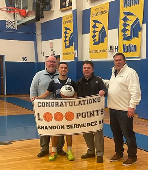 Brandon Bermudez holding 1000 points banner