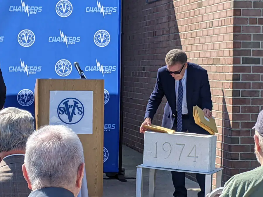The contents of the time capsule are removed from the vault by Dr. Bill Adams.